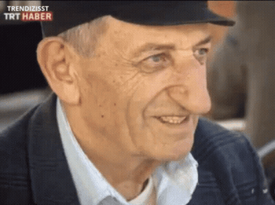 Man With Big Nose Smiling Wearing Trendizisst Hat GIF