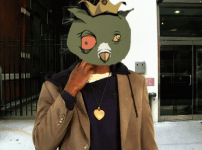 Man With Bird Mask in Front of Building