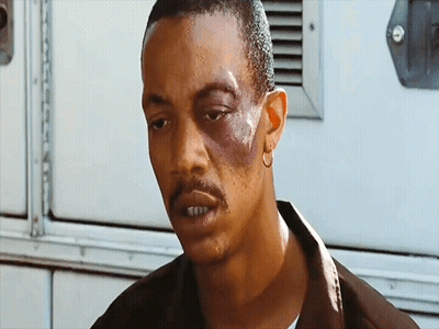 Man With Black Eye And Hoop Earrings GIF