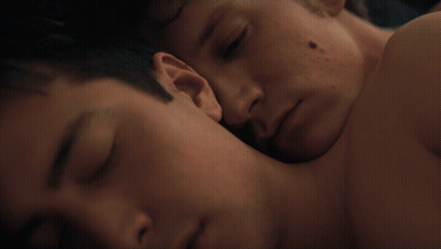Man With Black Spot Laying On Another Man's Chest GIF