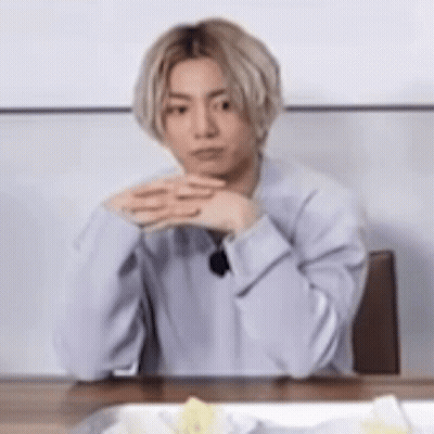 Man With Blonde Hair And Folded Hands GIF