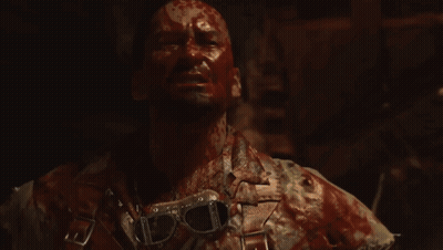 Man With Blood On Face Holding Hammer GIF