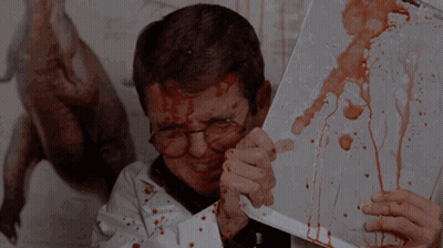 Man With Blood On Face Holding Knife GIF