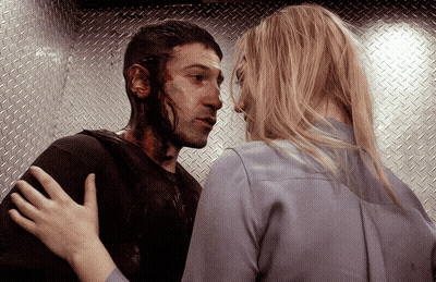 Man With Blood On Face Hugged By Blonde Woman GIF