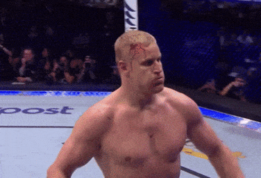 Man With Bloody Head Standing By Sign GIF