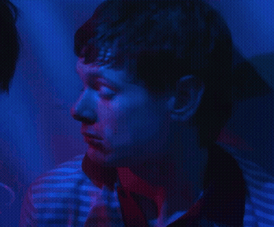 Man With Blue And Red Light Behind Him GIF