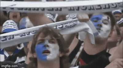 Man With Blue And White Paint Holding Amsterdam Scarf GIF