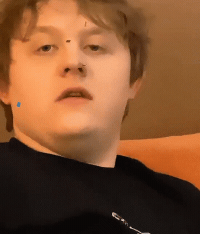 Man With Blue Circle On Cheek GIF