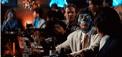 Man With Blue Face Sitting At Bar GIF