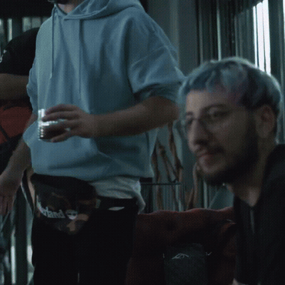 Man With Blue Hair And Glasses Looking GIF