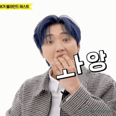 Man With Blue Hair And Plaid Jacket Holding NA GIF
