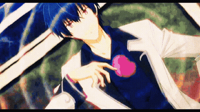 Man With Blue Hair And Red Eyes Holding Heart GIF