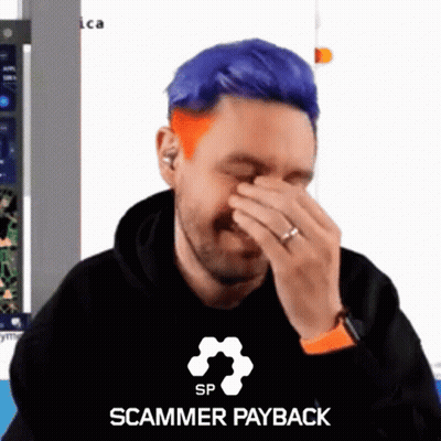 Man With Blue Hair Covering Face In Scammer Payback Shirt GIF