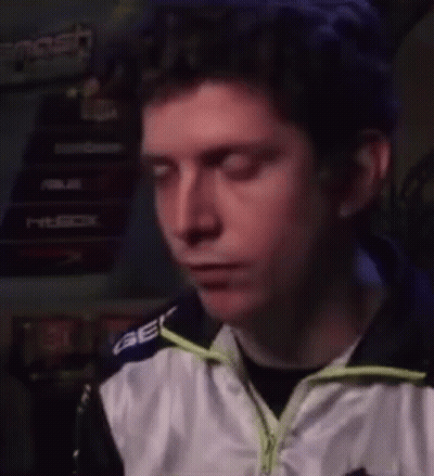 Man With Blue Hair In White And Black Jacket Making Funny Face GIF