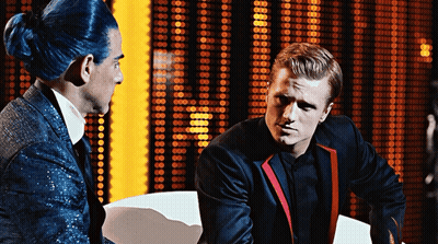 Man With Blue Hair Talks To Man In Suit GIF
