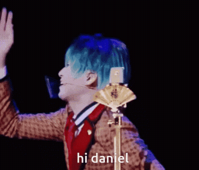 Man With Blue Hair Waving Saying Hi Daniel GIF