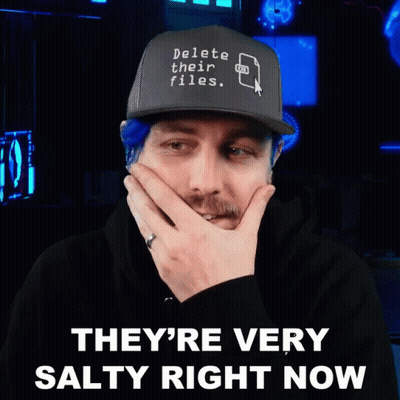 Man With Blue Hair Wearing Delete Their Files Hat GIF
