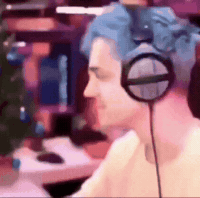 Man With Blue Hair Wearing Headphones Playing Video Game GIF
