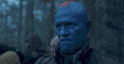 Man With Blue Paint Looking GIF
