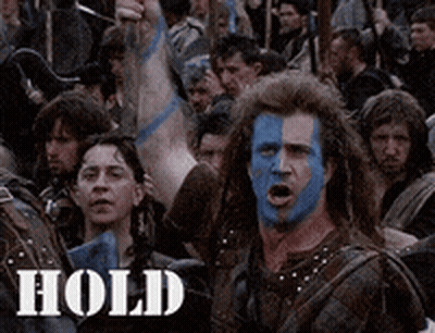Man With Blue Paint On Face Saying Hold GIF