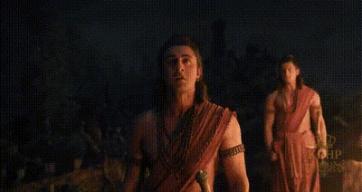 Man With Bow And Arrow Standing In Hut GIF