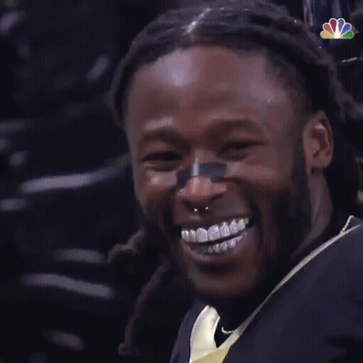 Man With Braces Smiling In NFL Jersey GIF