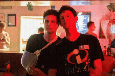 Man With Broken Arm Beside Winter Cup Shirt GIF
