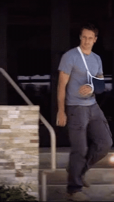 Man With Broken Arm Cast Walking Down Stairs GIF