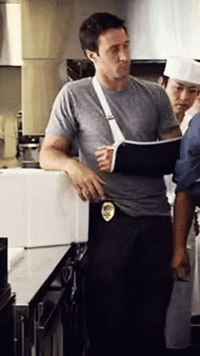 Man With Broken Arm In Cast In Kitchen GIF