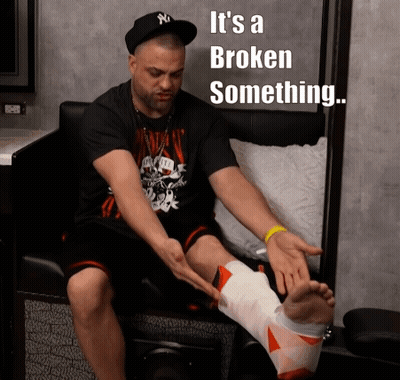Man With Broken Leg Sitting In Chair Saying It's A Broken Something GIF
