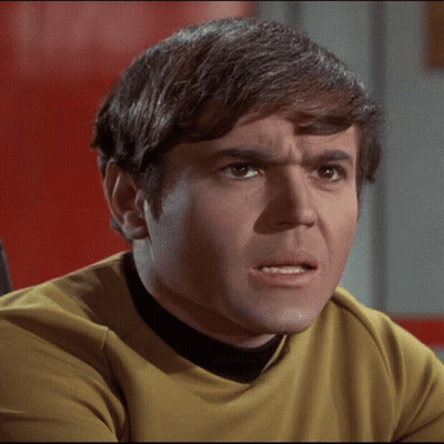 Man With Brown Hair And Yellow Shirt Making Funny Face GIF