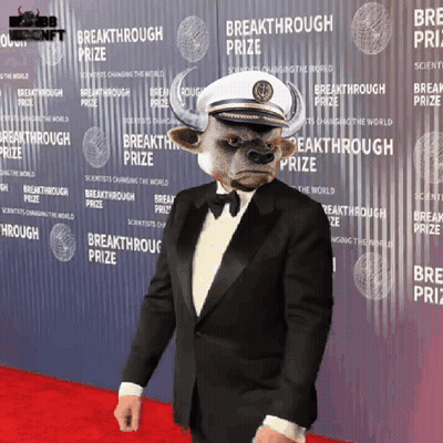 Man With Bull Head In Front Of Breakthrough Prize Wall GIF