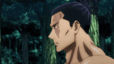 Man With Bun Standing In Forest GIF