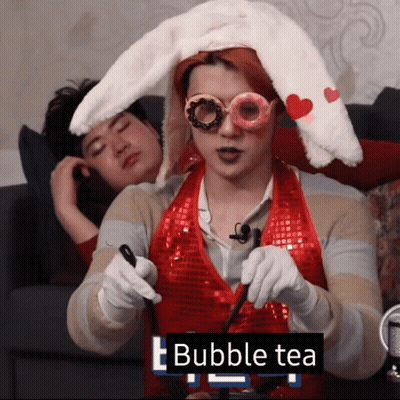 Man With Bunny Ears Holding Bubble Tea GIF