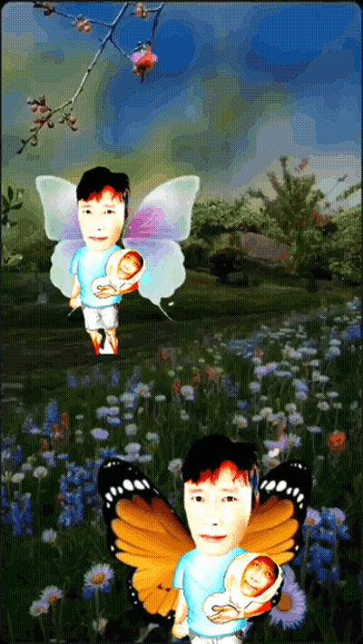 Man With Butterfly Wings Holding Baby GIF