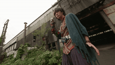 Man With Camera On Arm At Building GIF