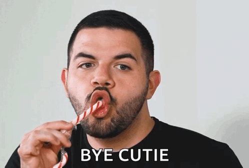 Man With Candy Cane Saying Bye Cutie GIF