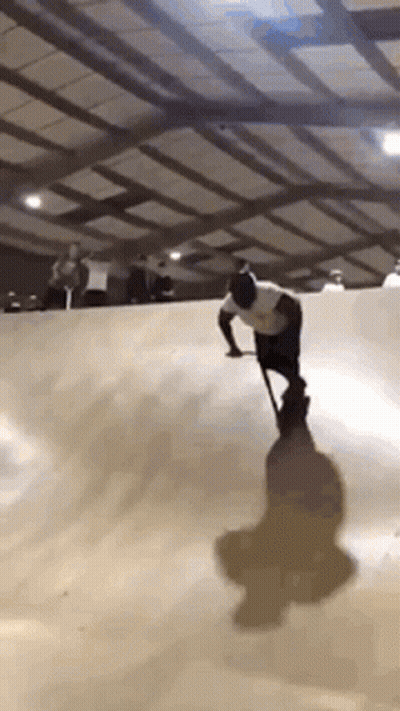Man With Cane Riding Skateboard GIF