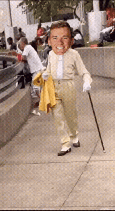Man With Cane Walking Down Sidewalk GIF