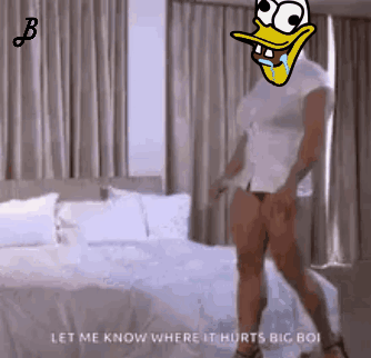 Man With Cartoon Duck On Head Standing On Bed GIF