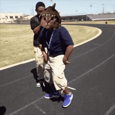 Man With Cat On Head Next To Man On Track GIF