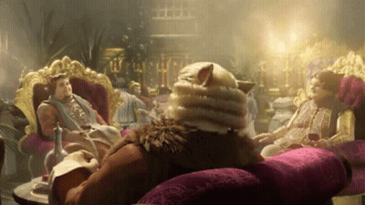Man With Cat's Head Sitting On Couch GIF