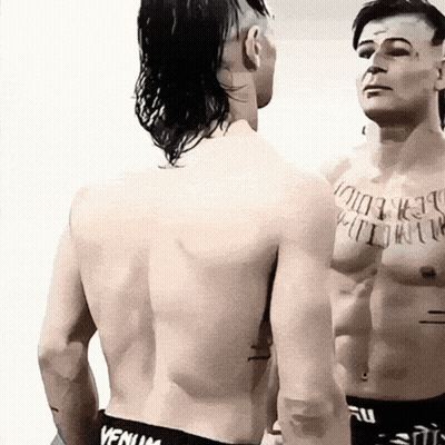 Man With Chest Tattoo In Black Venum Shorts GIF