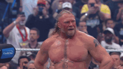 Man With Chest Tattoo In Wrestling Ring With Crowd GIF
