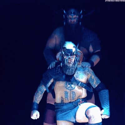 Man With Chest Tattoo Next To Man With Back Tattoo GIF