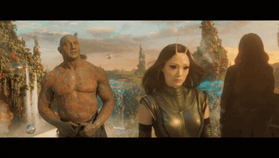 Man With Chest Tattoo Next To Woman GIF