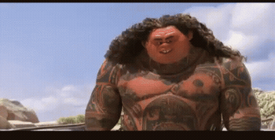 Man With Chest Tattoo On Rocky Beach GIF