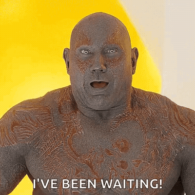 Man With Chest Tattoo Saying I've Been Waiting On Yellow Background GIF