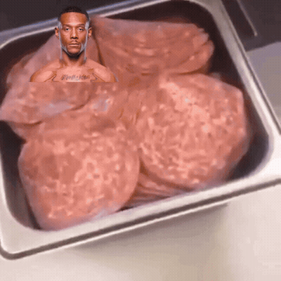 Man With Chest Tattoo Sitting In Meat Tray GIF