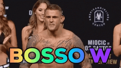 Man With Chest Tattoo Standing Before Women Bossow GIF